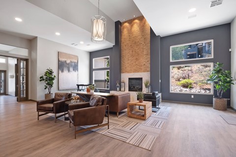 a living room with leather furniture and a fireplace